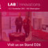 two people stood at exhibition stand with pink 'lab innovations' overlay