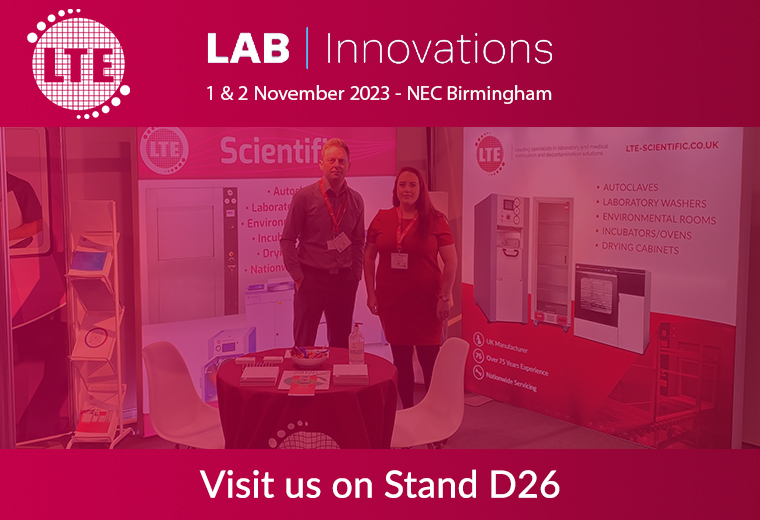 two people stood at exhibition stand with pink 'lab innovations' overlay